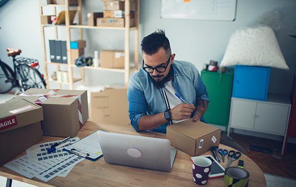 man packaging an item